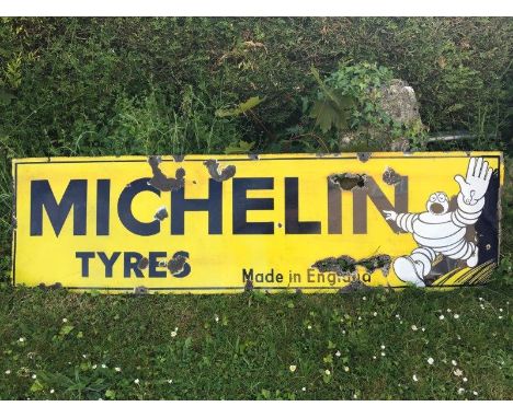 An early Michelin Tyres 'Made in England' rectangular enamel sign, 57 1/2 x 16". 