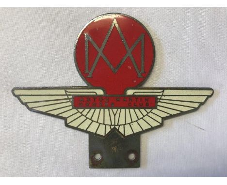 An Aston Martin Owner's Club enamel car badge.