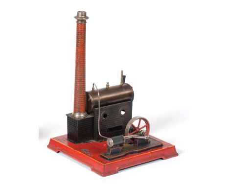 J Falk Live Steam Stationary Engine consisting of horizontal boiler mounted on brick effect base and chimney, connected to si