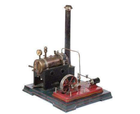 J Falk Live Steam Stationary Engine consisting of horizontal boiler mounted on brick effect base and plain chimney, connected