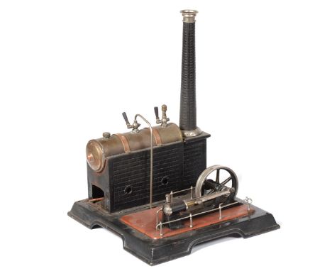 Marklin Live Steam Stationary Engine consisting of horizontal brass boiler with GMC crest to side, mounted on brick effect st