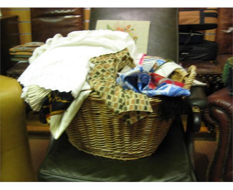 Wicker basket containing misc vintage scarves,gloves and apron etc..