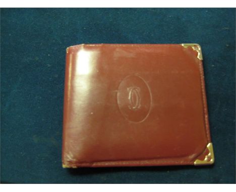 a vintage cartier wallet in Burgundy