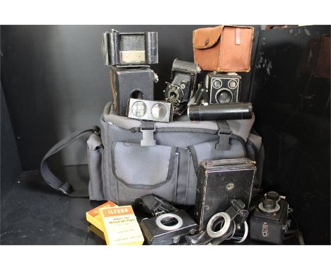 Vintage cameras , parts and accssoriesin a Unomat video bag. Includes a Kodak six-20 "Brownie C" Rollex - Patent , a vest poc
