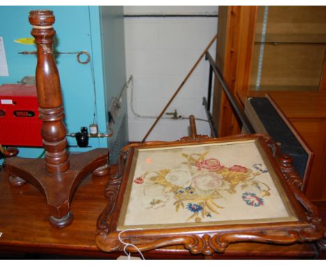 A mid-Victorian mahogany pole screen, having a floral tapestry inset panel (with damages to column)