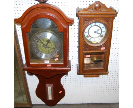 A contemporary wall clock, having an arched dial with lower inset thermometer, together with a further 1920s oak drop trunk w