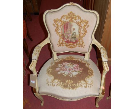 A pair of Louis XV style cream painted floral tapestry upholstered and further studded open armchairs, together with a furthe