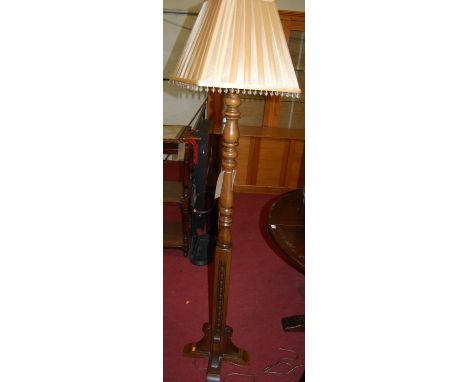 A contemporary Wood Brothers moulded oak standard lamp, the column of turned and square form, with silk shade, overall h.175c