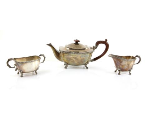 George VI silver three piece tea service, comprising teapot, cream jug and sugar bowl, with moulded band of Celtic knotwork d