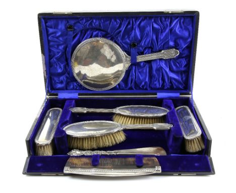 George V silver-mounted dressing table set, in fitted case, by J &amp; R Griffin, Chester 1913, comprising hand mirror, two b