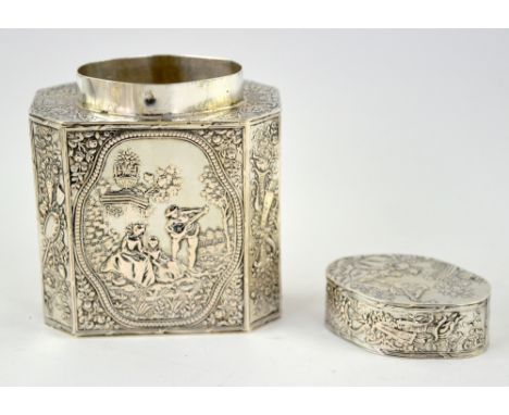 German silver tea-caddy and cover, the capped octagonal body chased with figures in a landscape, stamped 800, 11 cm high, 5.8