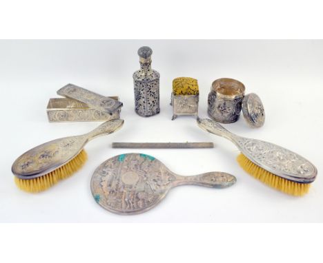 Indian silver and white metal dressing table items to include a scent bottle, two dressing table pots, a pin cushion, two bru