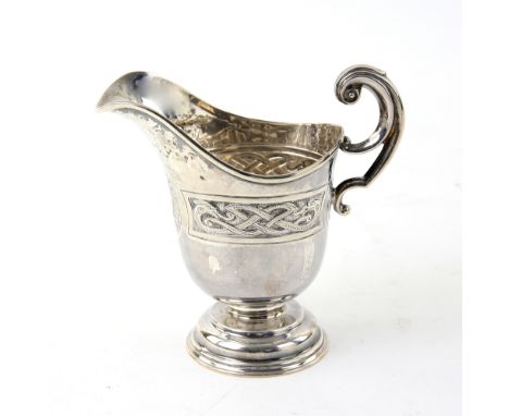 Edward VII Irish silver cream jug with Celtic knotwork decoration, on round foot, maker's mark 'JS', Dublin, 1909, 4.8oz, 150