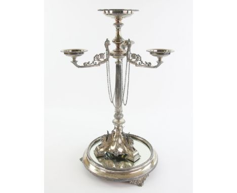 Victorian silver epergne with three beaded bowl holders with scrolling and ram's head decoration, and hanging chains, on flut