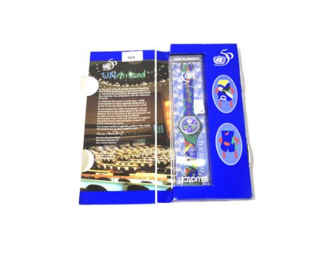 A Swatch 50th anniversary Chrono watch. In the original packaging