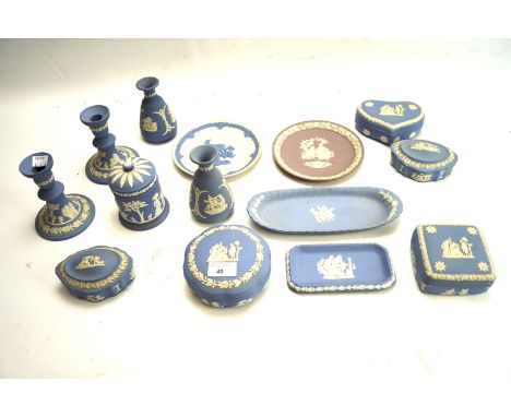 A collection of Wedgwood jasperware. Including a pair of candlesticks, lidded pots, plates, etc, some in the original boxes