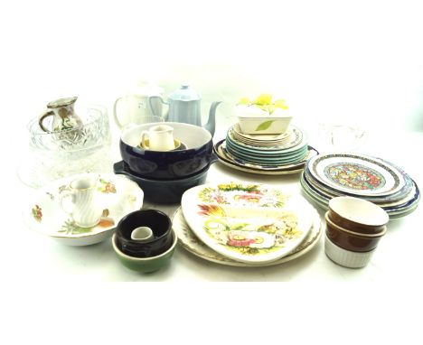 An assortment of mixed ceramics and glass. Including plates, dishes, footed glass bowls, etc. 