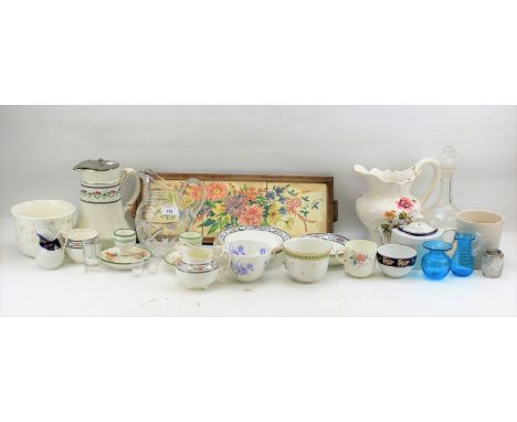 An assortment of ceramics and glassware. Including a Wedgwood planter, glass jug, cups and saucers, etc