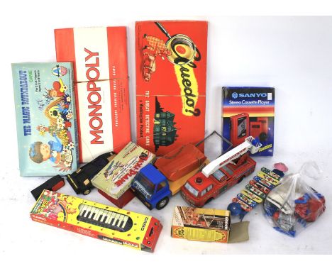 An assortment vintage toys and accessories. Including a Casio SA-2 keyboard, a Sanyo Stereo Cassette Player model M-G7SP, Jap