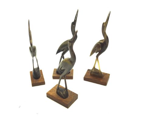 Four carved horn figures of cranes. Mounted on wooden bases, H17cm