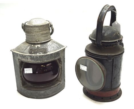 A vintage railway lantern and a ship's lantern. Both with metal frames and handles to the top, largest H30cm