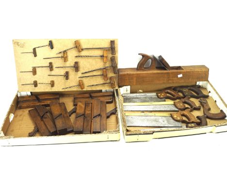 An assortment of vintage tools. Including an I Sorby saw, W Marples &amp; Sons plane,  wooden handled screws, etc