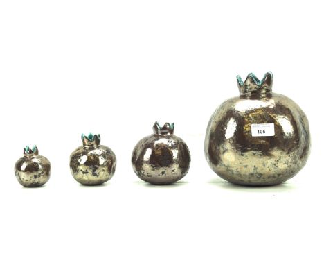 Four ceramic vases of graduating sizes. In a metallic and blue glaze, signed 'Sibel &amp; Özgür Doluel' to the bases, tallest