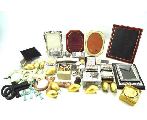 A assortment of collectables. Including a silver photo frame, ceramics, decorative boxes, a harmonica, etc