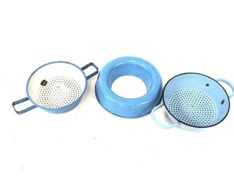 Three pieces of mid-century blue and white enamel kitchenware. Including two strainers and a blanching mould