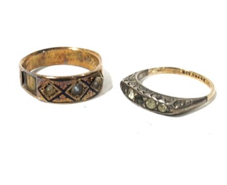 A Victorian yellow metal mourning ring and a yellow metal five stone ring. The five stone ring ring marked '9ct Shank', size 