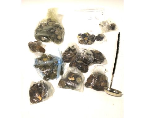 An assortment of coinage. Including three pence, pennies, six pence, etc, together with a Georgian white metal handled ladle