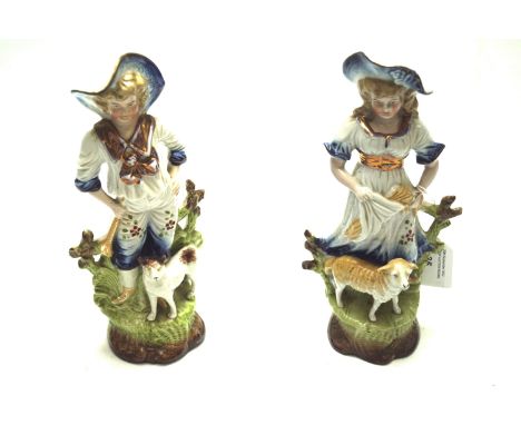 Ceramic shepherd and shepherdess figures. Staffordshire style, dressed in traditional clothing with gilt details, H24cm