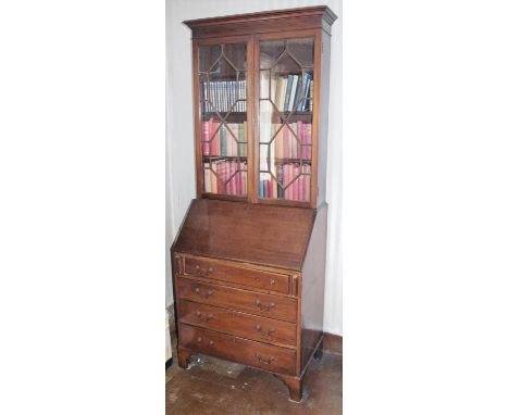 An early 20th century mahogany bureau bookcase, moulded cornice, above astragal glazed doors, the fall front above four long 
