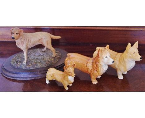 A Beswick Corgi, printed mark;  another, similar;  another, smaller;  Country Artist labrador**Please note all lots must be c