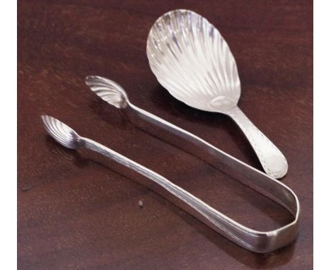 A 19th century caddy spoon, shell bowl;  a set of 19th century silver sugar bows 