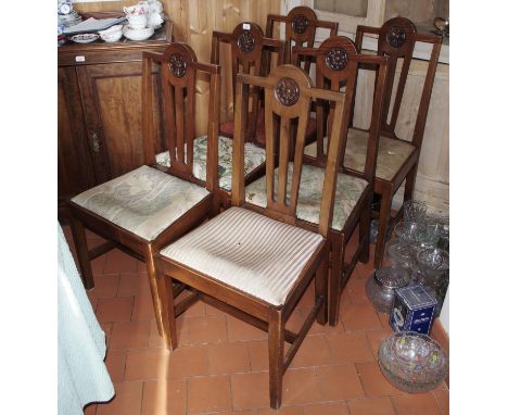 A set of six Edwardian walnut dining chairs, carved with Tudor roses, drop in seats, c.1910**Please note all lots must be col