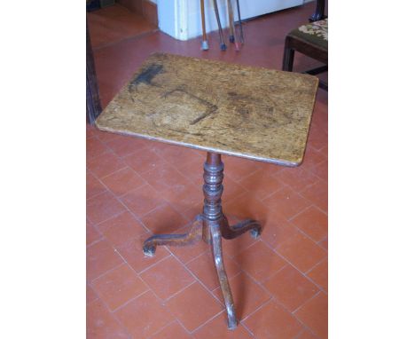 A George III oak occasional table, rounded rectangular top, turned column, tripod base, 70cm high, 42cm wide, 51cm deep,  c.1