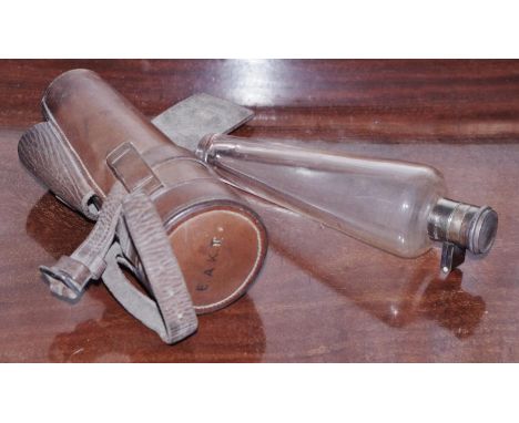 A George V silver-mounted glass tapering hunting flask, retailed by Harrods, London, quite plain, 18cm long, brown leather ca