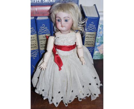 A German  bisque head doll, for the French market, sleeping blue eyes,  open mouth, dimple to chin, jointed composite body, D