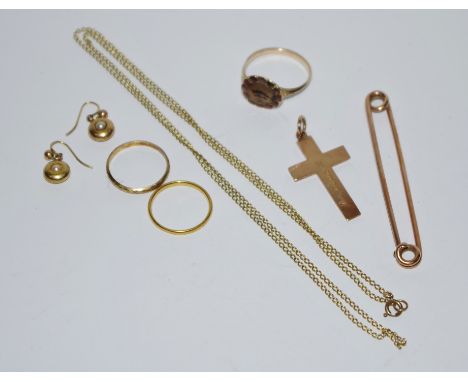 A pair of 15ct gold earrings, 1.6g; an 18ct gold ring, 1.3g;  a 9ct gold crucifix, 2.3g; an gold coloured metal ring,  unmark