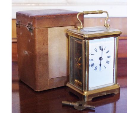 A French lacquered brass carriage clock, 5.5cm rectangular enamel dial inscribed with Roman numerals, 14-day movement with pl