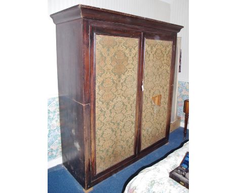 A large Victorian faux rosewood scumbled pine country house linen cupboard, moulded outswept cornice above a pair of tapestry