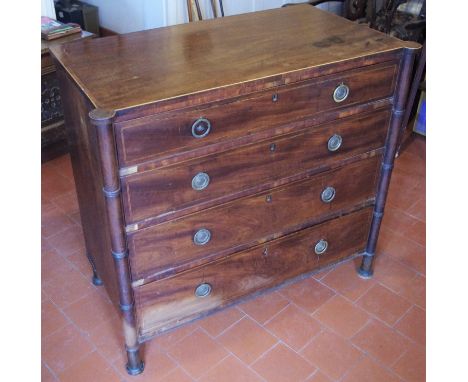 A 19th century chest, possibly Channel Islands, of four long graduated cockbeaded drawers, flanked by faux bamboo columns to 