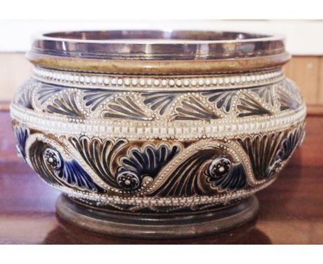 A Royal Doulton bowl, designed by GTH, in relief and incised with undulating beaded line with floral roundels and leaves, sil