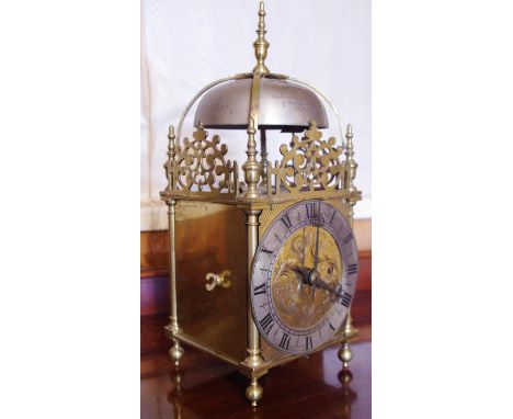 A 17th century style brass lantern clock, 13cm silvered dial inscribed Gokdsmiths & Silversmiths, Regent St, London, fusee mo