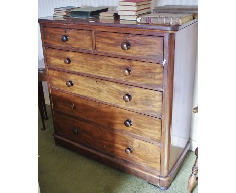 A Victorian mahogany mahogany chest, oversailing rounded rectangular top above two short and four long graduated cockbeaded d