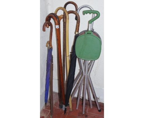 An early 20th century bamboo walking stick;  others;  umbrellas;   etc**Please note all lots must be collected from Sudbury, 