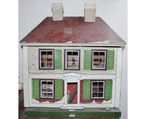 An early 20th century doll's house, by Hamley's, London, 75cm high, 66cm wide, c.1935**Please note all lots must be collected