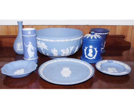 A Wedgwood Blue Jasperware bowl, typically applied in white with classical figures, 20cm diam, impressed mark;  a similar pla