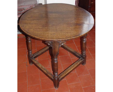 A late 17th/early 18th century circular occasional table, the top of plank construction above a stop fluted frieze, shaped ap
